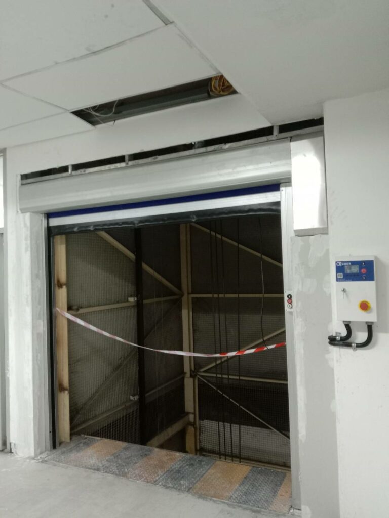 High speed door interlock with cargo lift