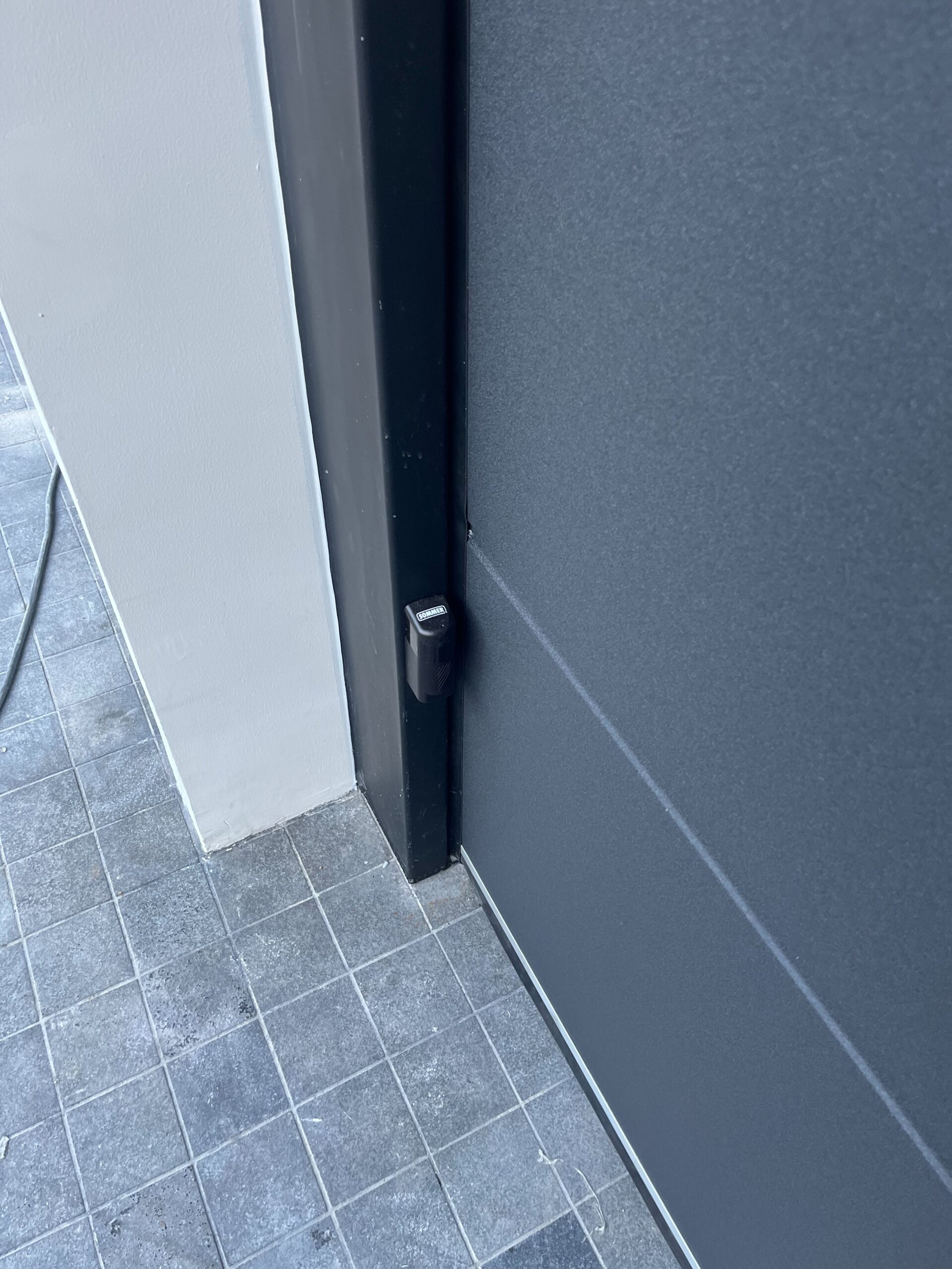 Installation photo of Garage Doors for Housing Estate / Developer in Samut Prakan by OZ DOOR (2)