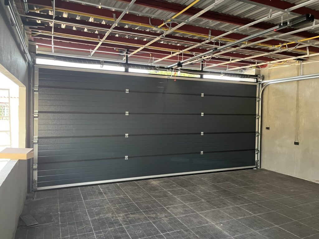 Installation photo of Garage Doors for Housing Estate / Developer in Pathum Thani by OZ DOOR (2)