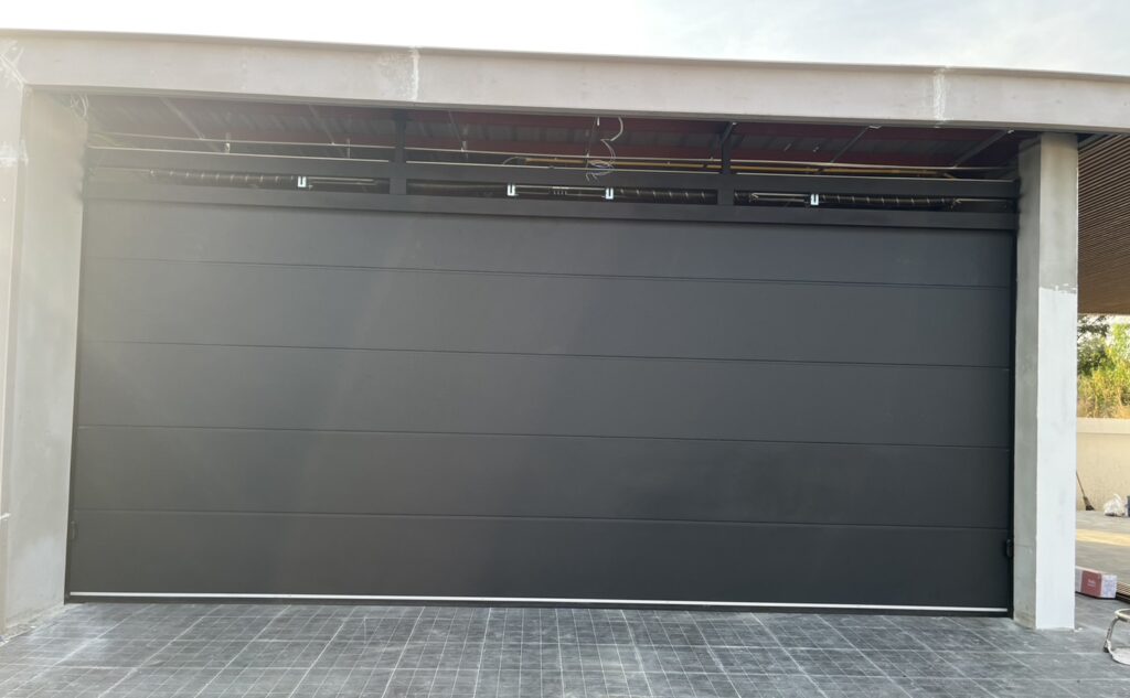 Installation photo of Garage Doors for Housing Estate / Developer in Pathum Thani by OZ DOOR