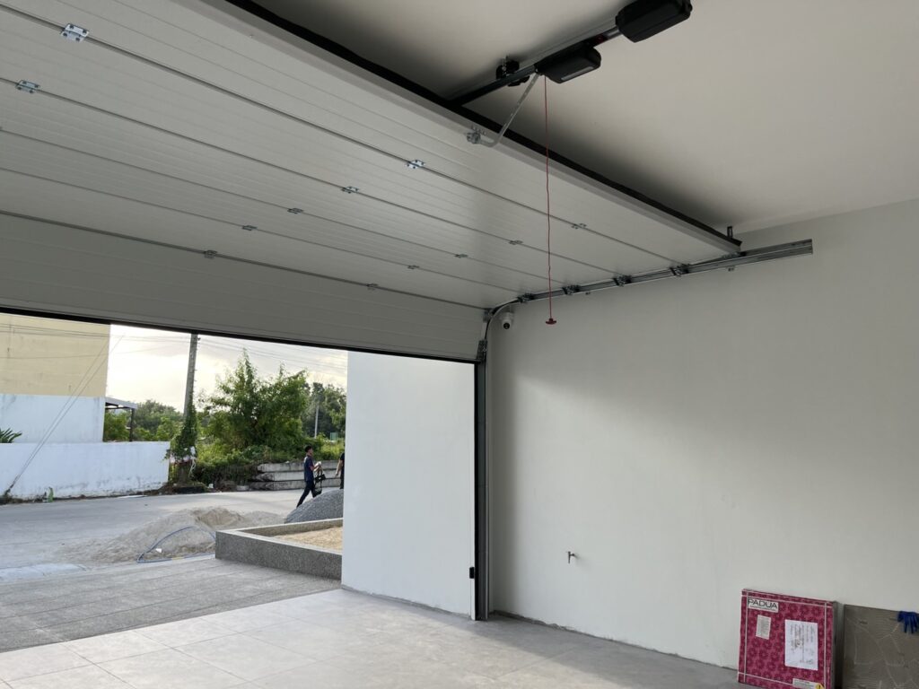 Installation photo of Garage Doors for Housing Estate / Developer in Nakhon Si Thammarat by OZ DOOR (3)