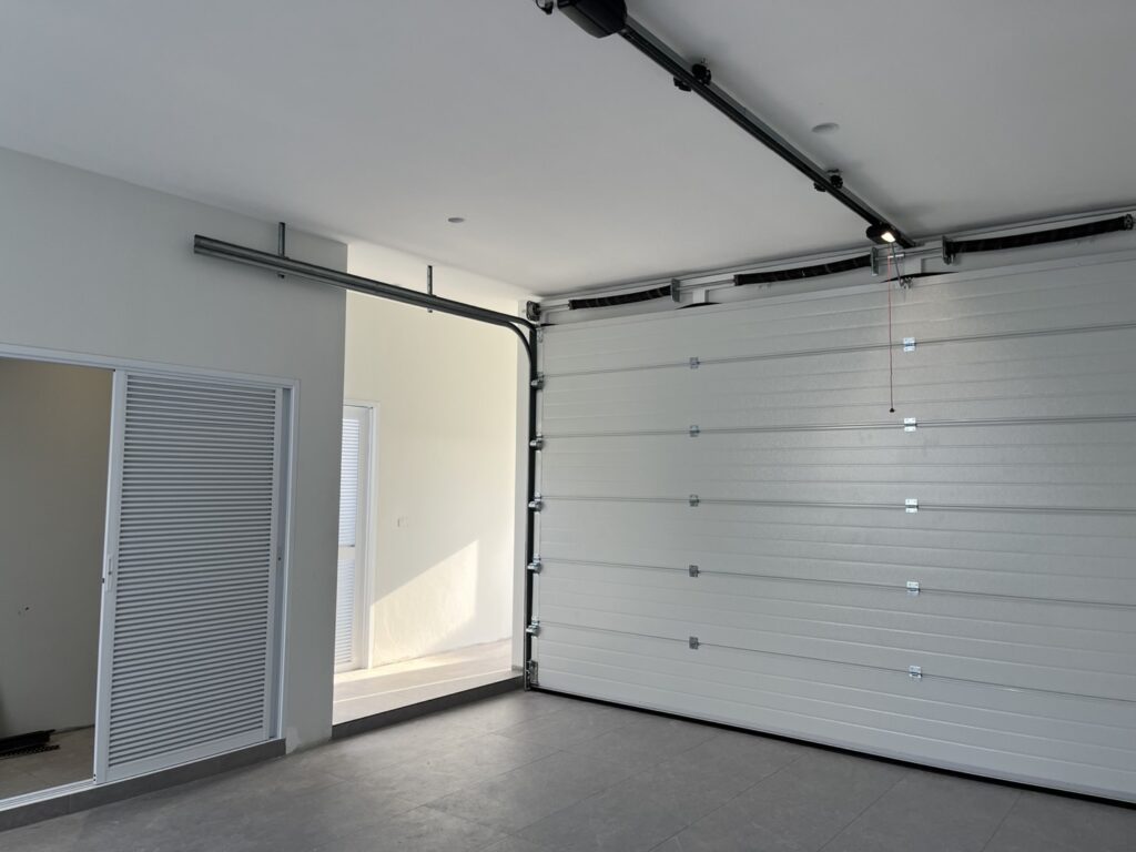Installation photo of Garage Doors for Housing Estate / Developer in Nakhon Si Thammarat by OZ DOOR (6)