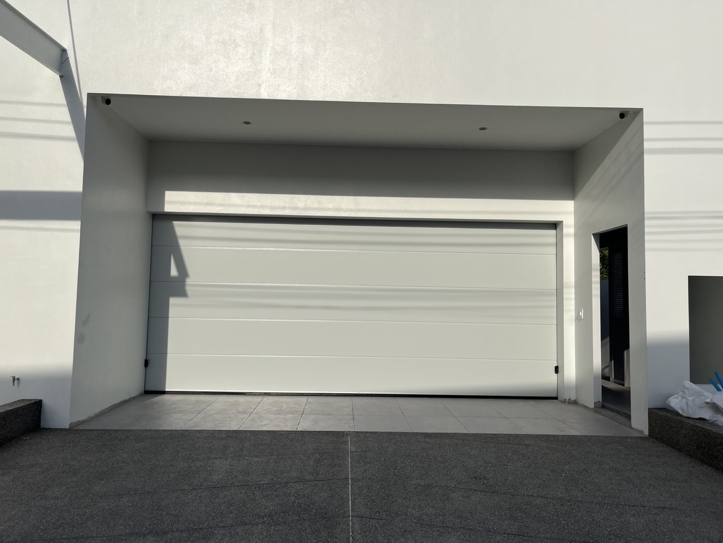Installation photo of Garage Doors for Housing Estate / Developer in Nakhon Si Thammarat by OZ DOOR