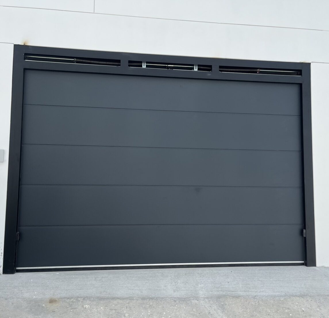 Installation photo of Garage Doors for Single House in Phuket by OZ DOOR