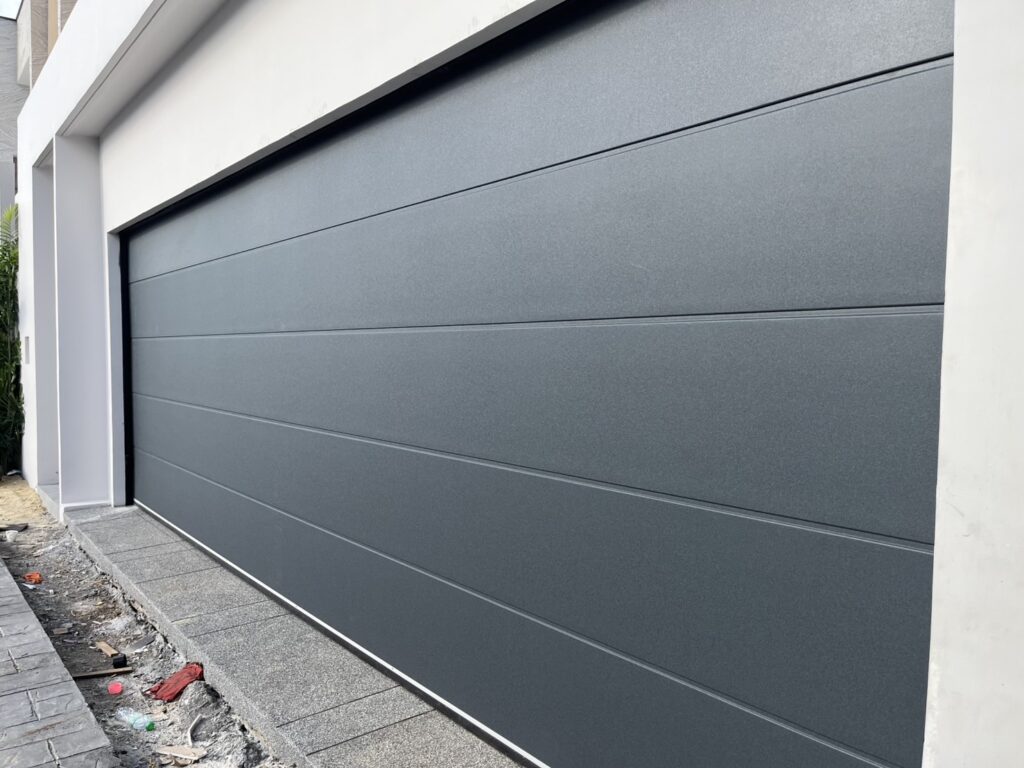 Installation photo of Garage Doors for Housing Estate / Developer in Nonthaburi by OZ DOOR (5)