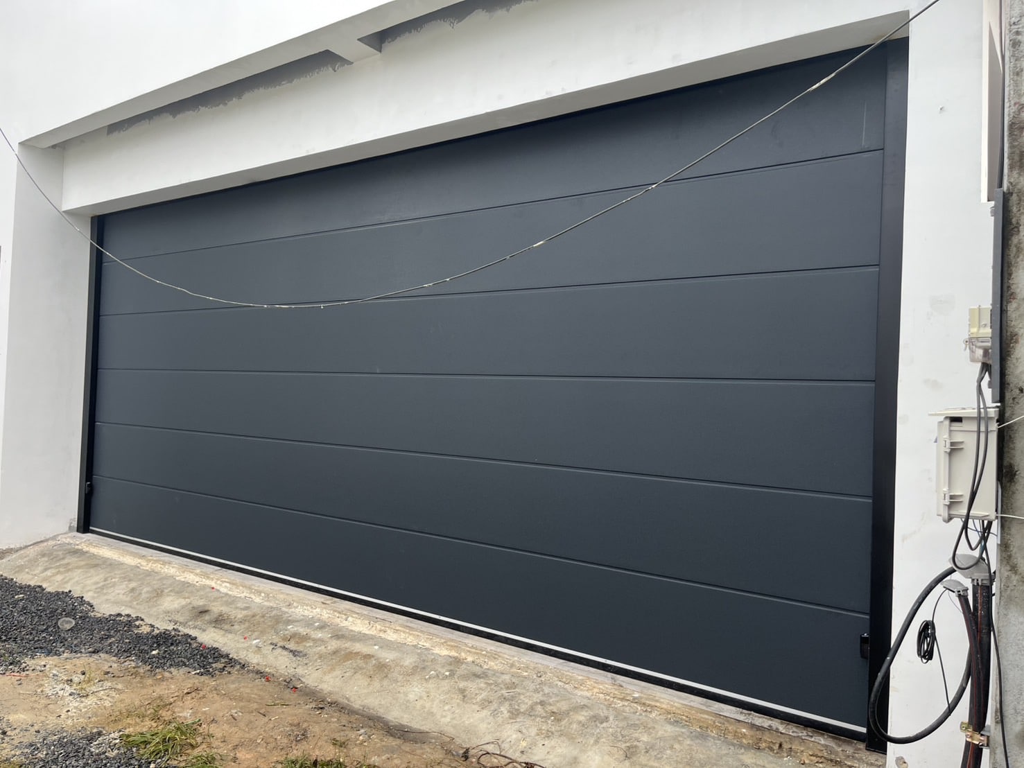 Installation photo of Garage Doors for Single House in Phuket by OZ DOOR