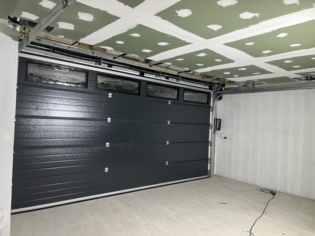 Installation photo of Garage Doors for Single House in Samut Prakan by OZ DOOR (4)