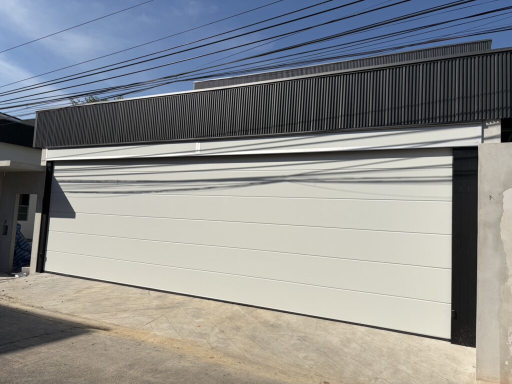 Installation photo of Garage Doors for Housing Estate / Developer in Pathum Thani by OZ DOOR (2)