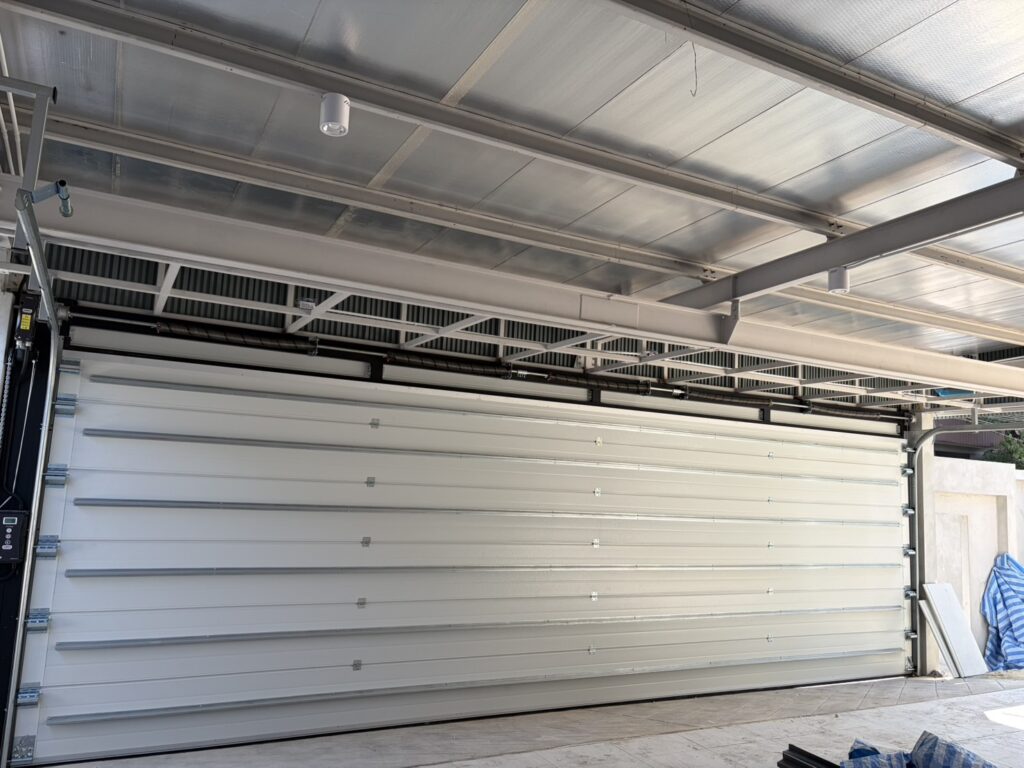 Installation photo of Garage Doors for Housing Estate / Developer in Pathum Thani by OZ DOOR (26)