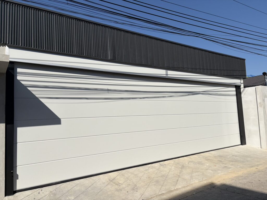 Installation photo of Garage Doors for Housing Estate / Developer in Pathum Thani by OZ DOOR