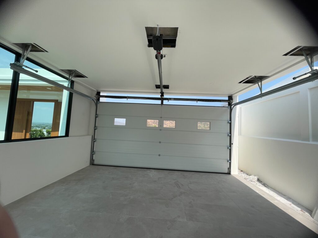 Installation photo of Garage Doors for Housing Estate / Developer in Phuket by OZ DOOR