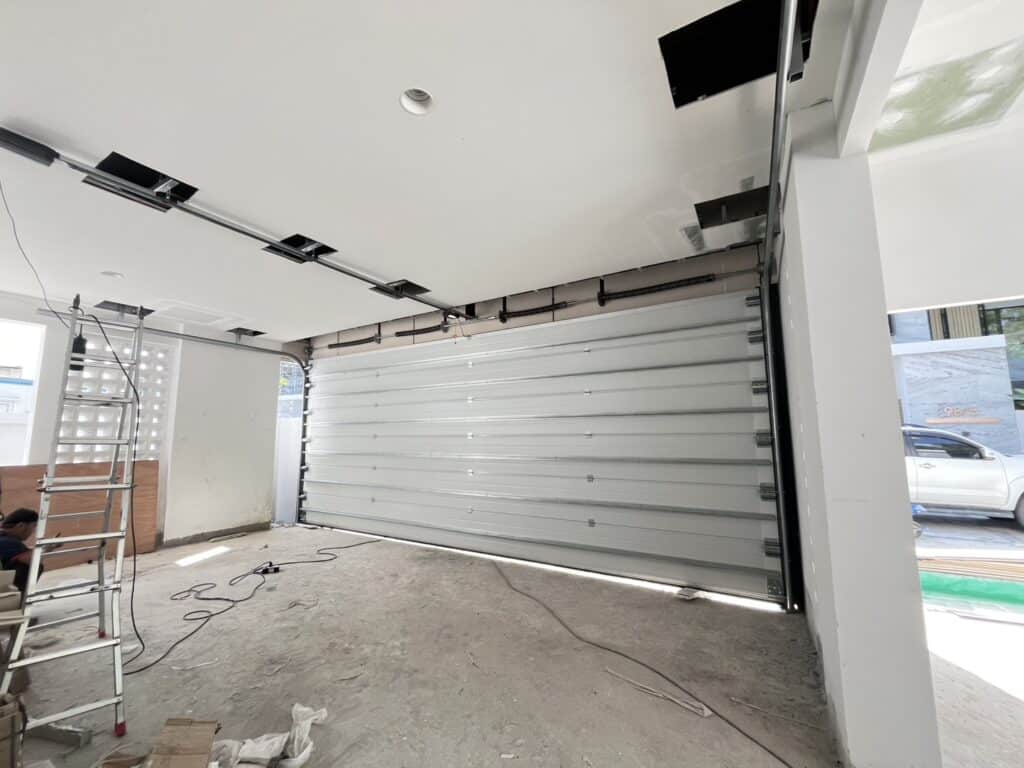 Installation photo of Garage Doors for Housing Estate / Developer in Nonthaburi by OZ DOOR (3)