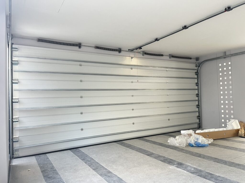 Installation photo of Garage Doors for Housing Estate / Developer in Nonthaburi by OZ DOOR (4)