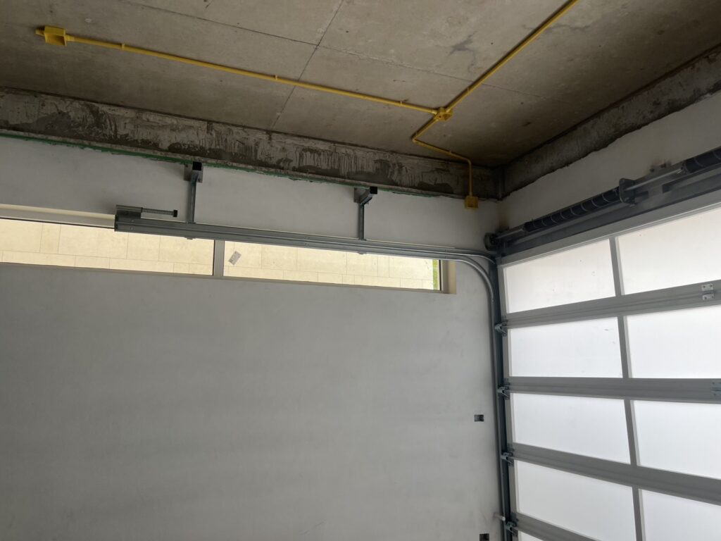 Installation photo of Full View Garage Door for Single House in Chonburi by OZ DOOR (2)