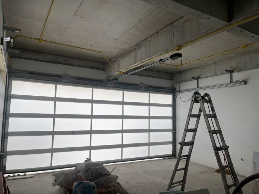 Installation photo of Full View Garage Door for Single House in Chonburi by OZ DOOR (4)