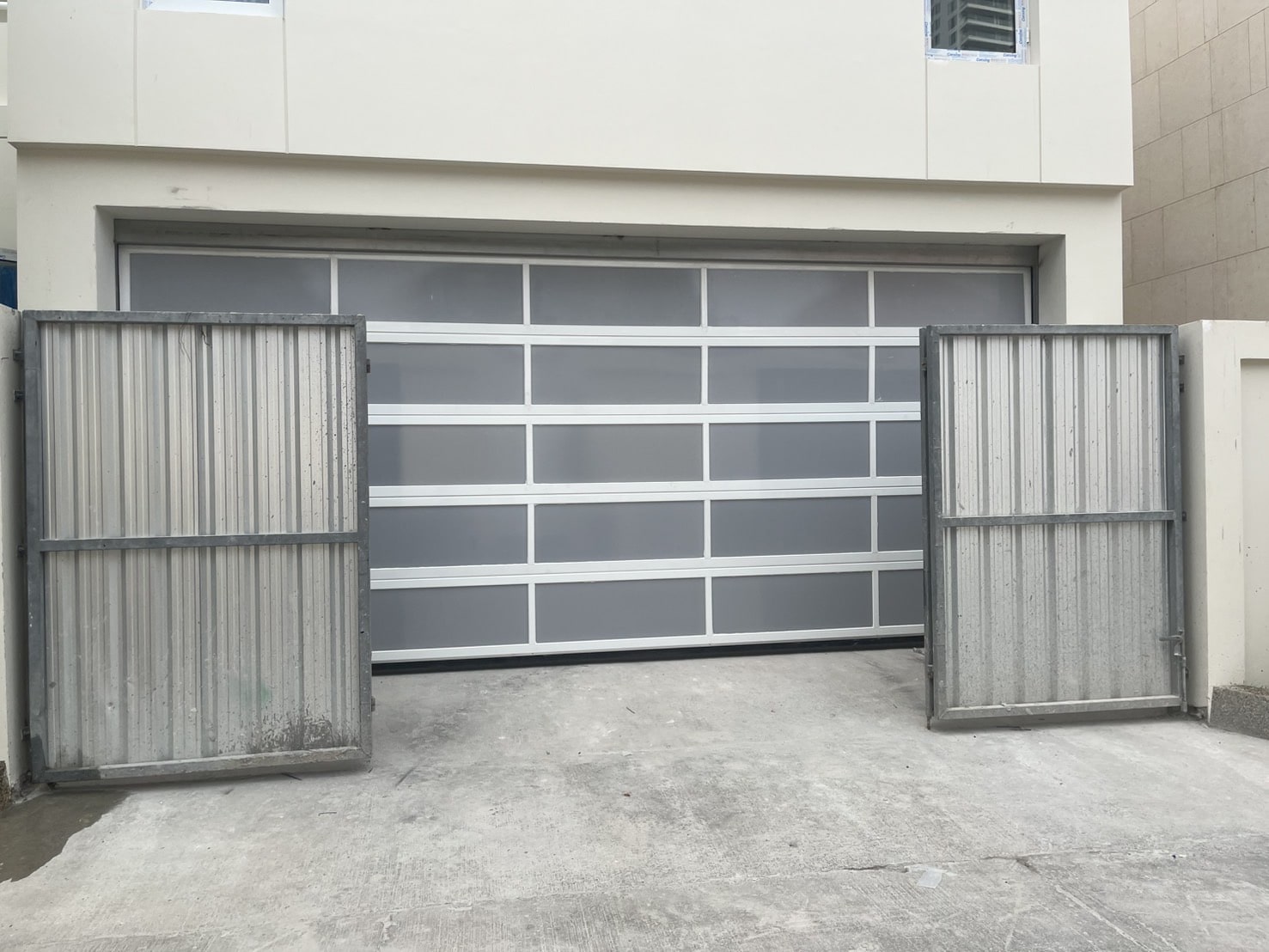 Installation photo of Full View Garage Door for Single House in Chonburi by OZ DOOR