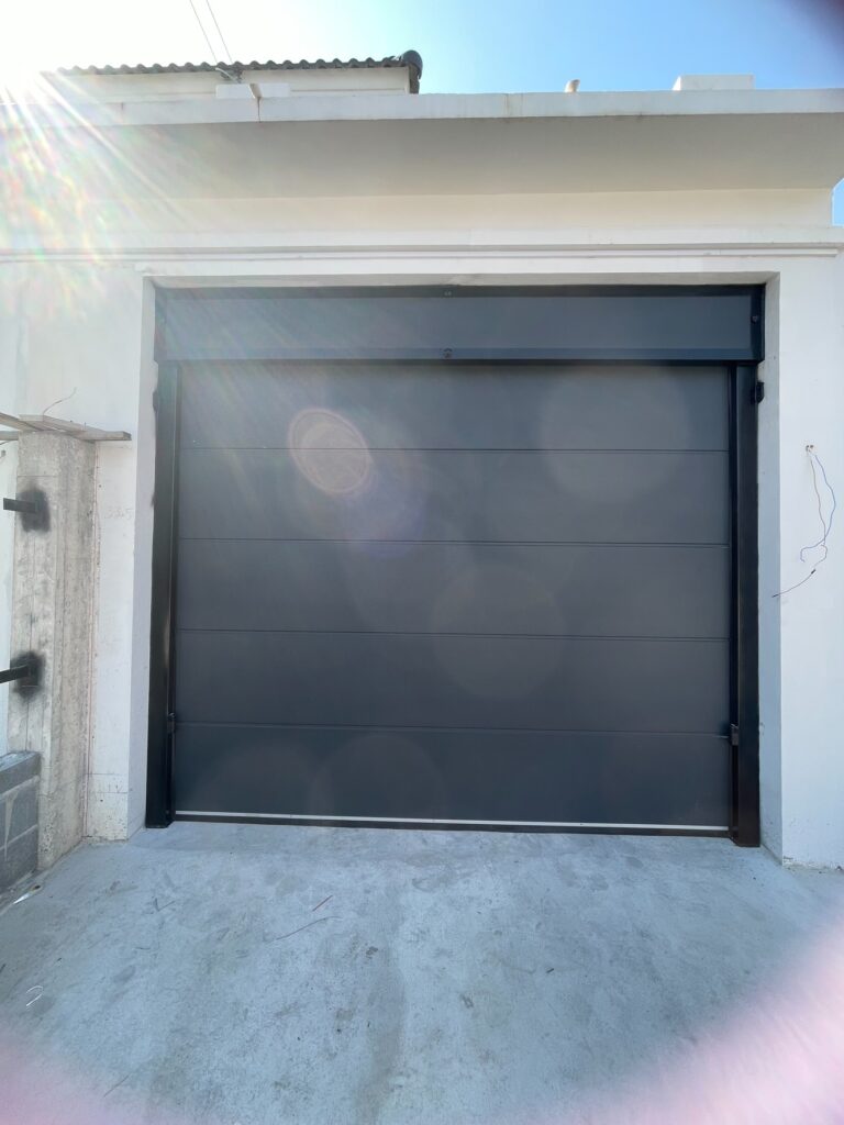 Installation photo of Standard Garage Door for Single House in Rayong by OZ DOOR