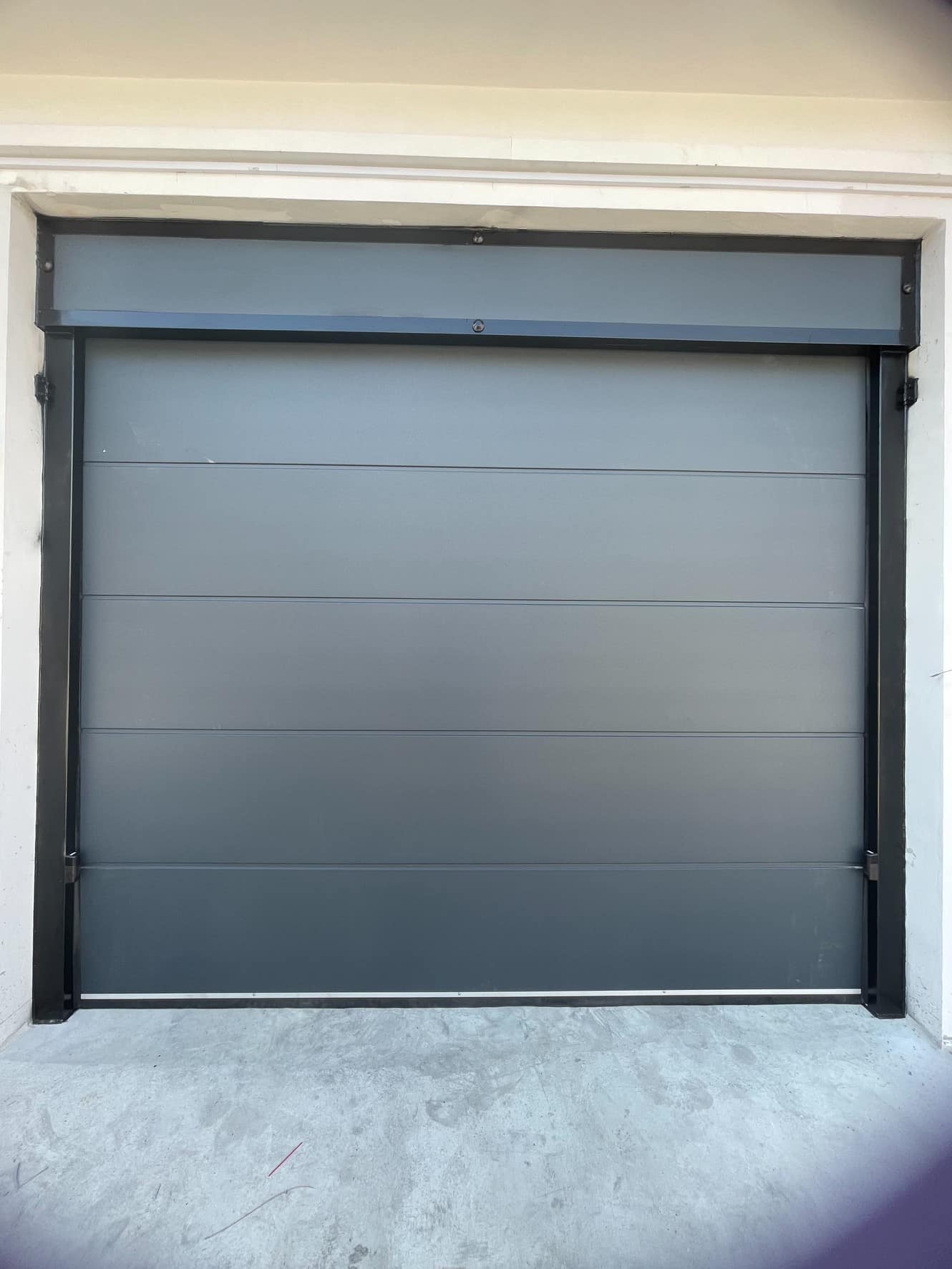 Installation photo of Standard Garage Door for Single House in Rayong by OZ DOOR