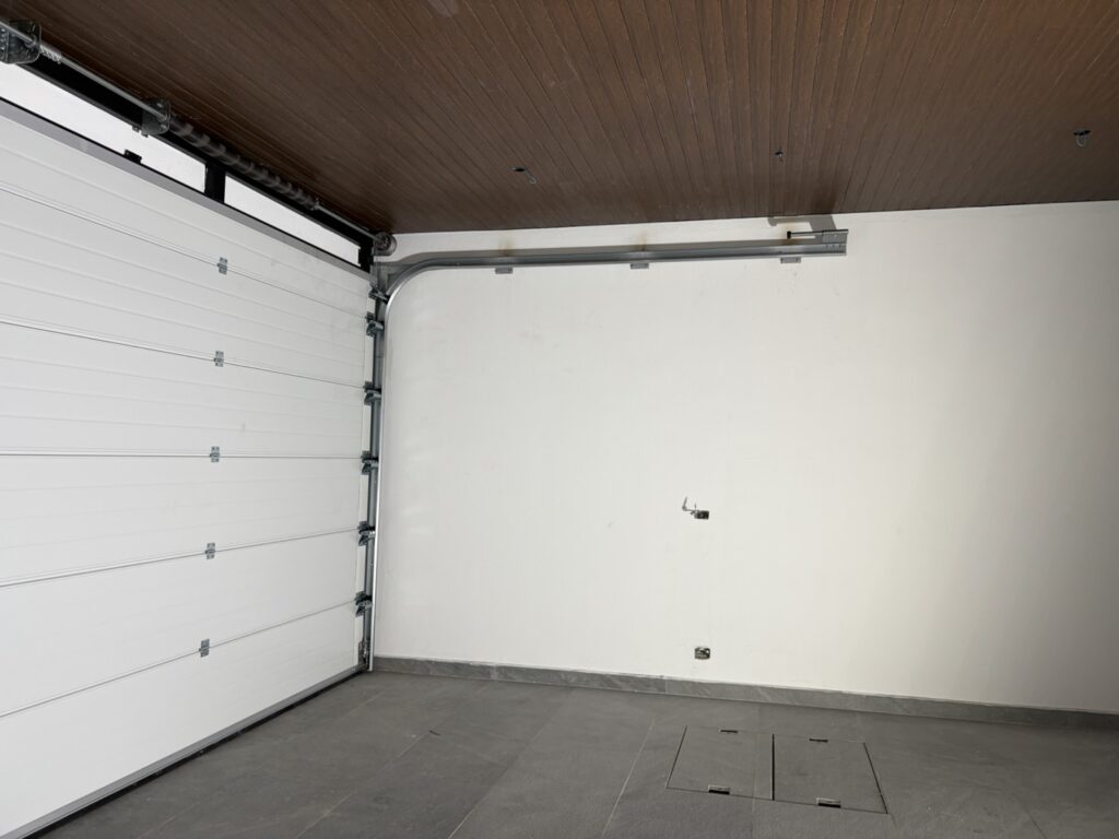 Installation photo of Standard Garage Door for Housing Estate / Developer in Chonburi by OZ DOOR (11)