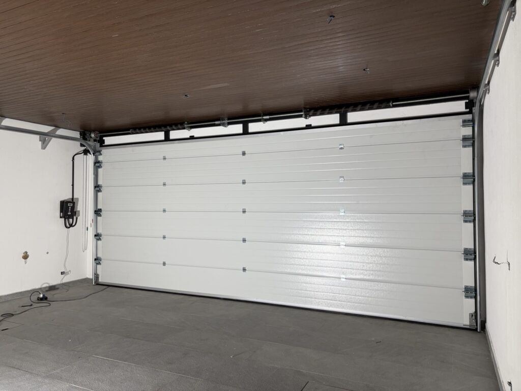 Installation photo of Standard Garage Door for Housing Estate / Developer in Chonburi by OZ DOOR (12)