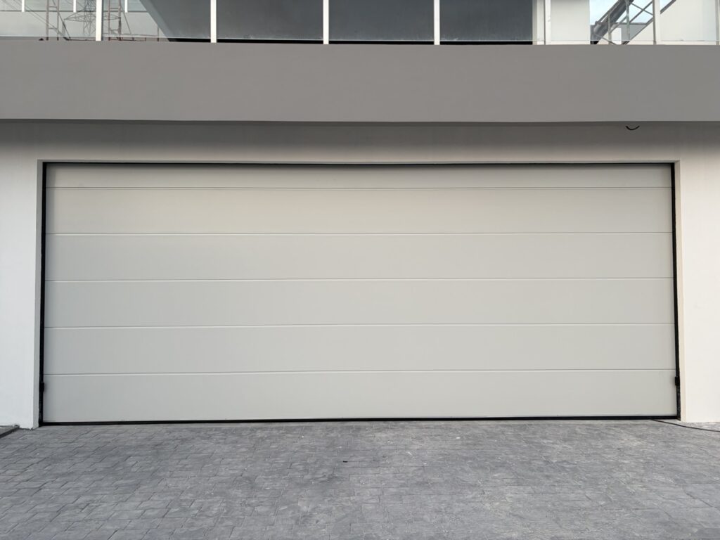 Installation photo of Standard Garage Door for Housing Estate / Developer in Chonburi by OZ DOOR (3)