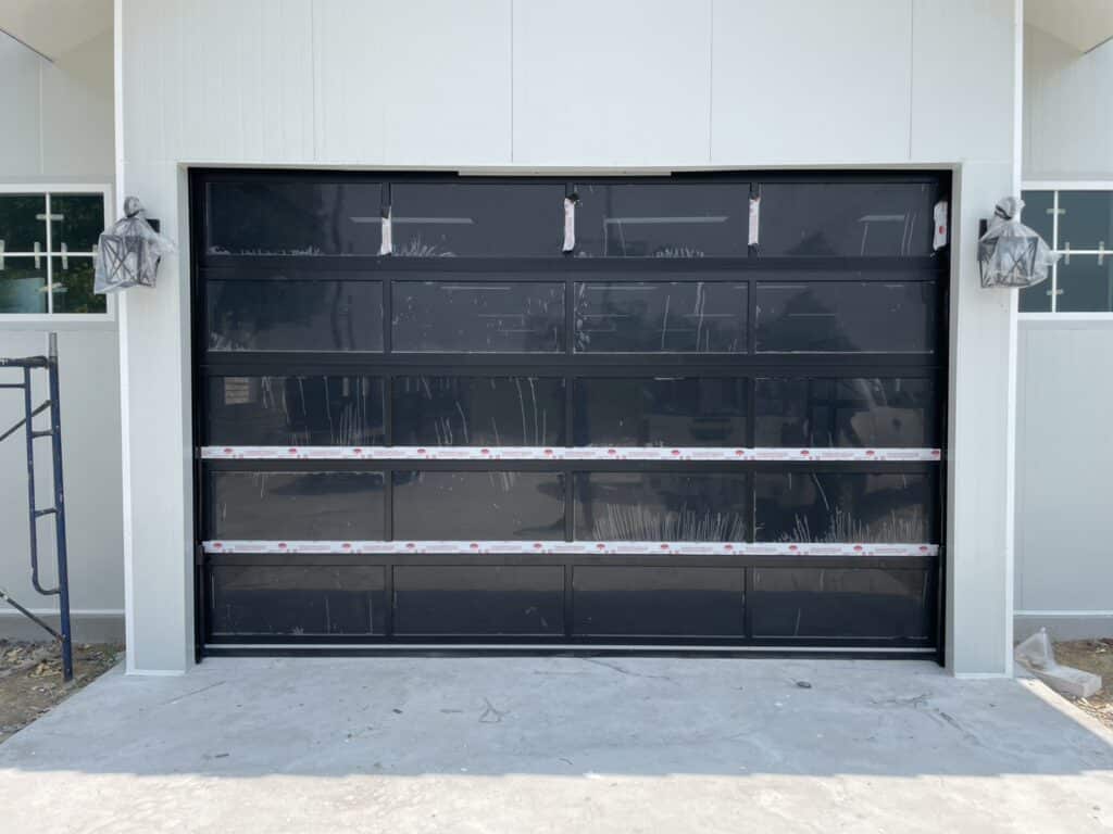 Installation photo of Full View Garage Door for Single House in Bangkok by OZ DOOR