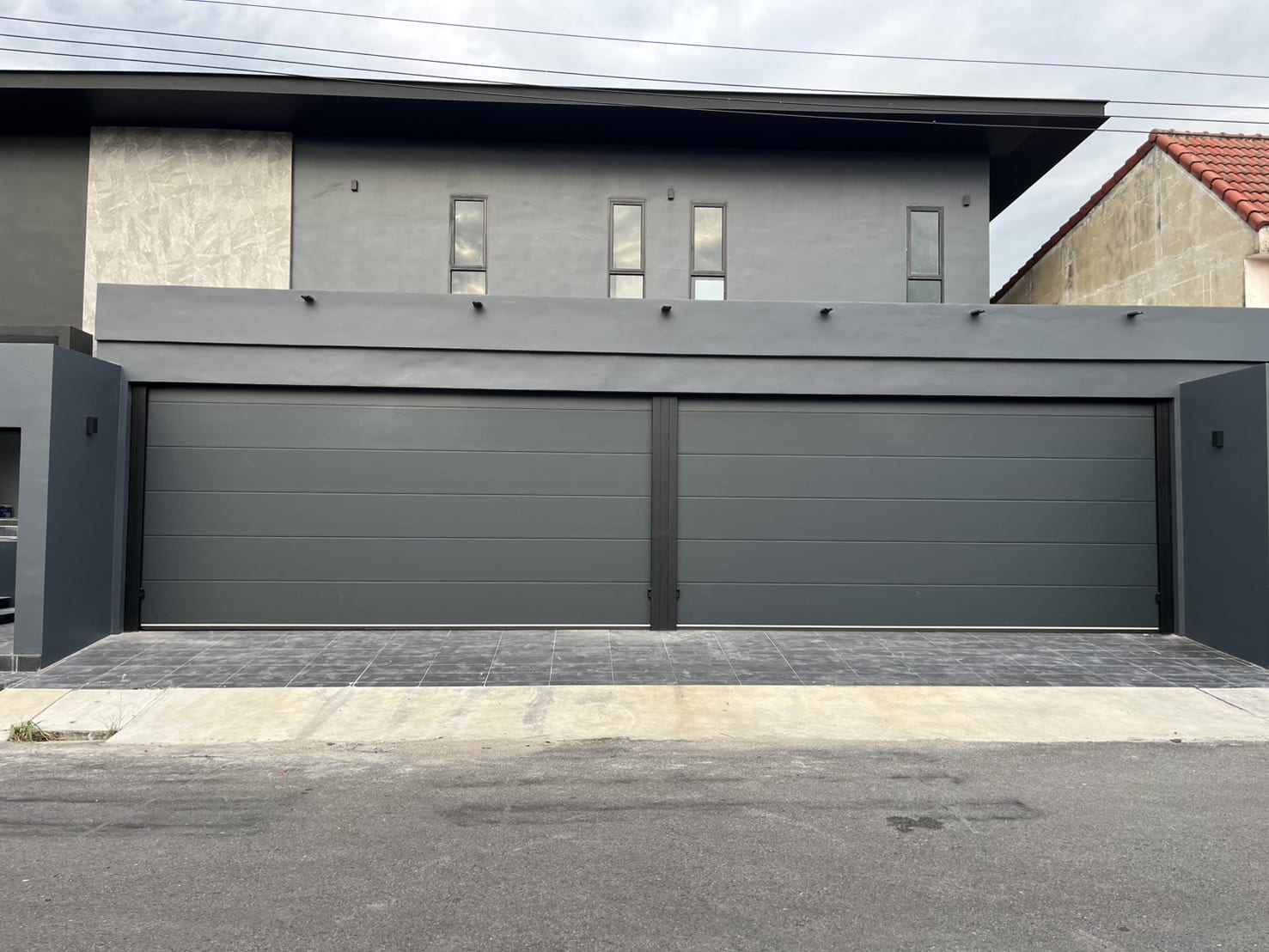 Installation photo of Standard Garage Door for Single House in Nonthaburi by OZ DOOR