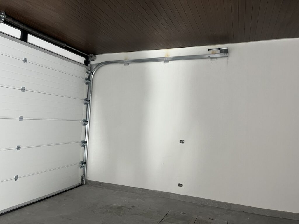 Installation photo of Standard Garage Door for Housing Estate / Developer in Chonburi by OZ DOOR (5)