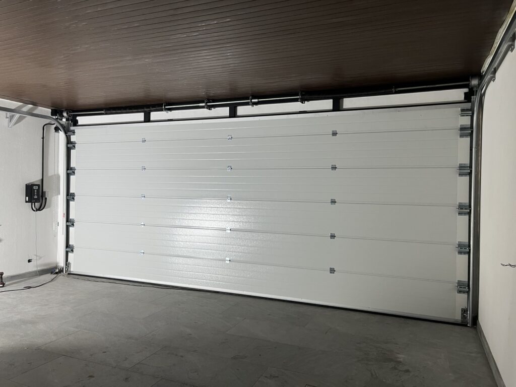 Installation photo of Standard Garage Door for Housing Estate / Developer in Chonburi by OZ DOOR (2)