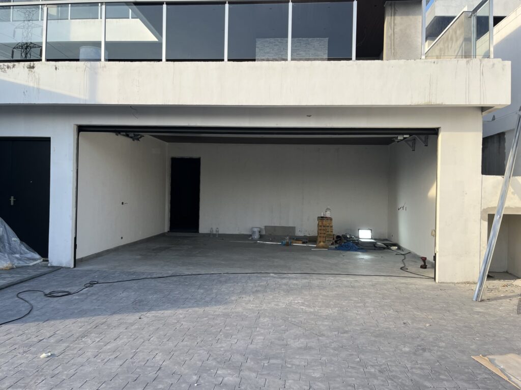 Installation photo of Standard Garage Door for Housing Estate / Developer in Chonburi by OZ DOOR (7)