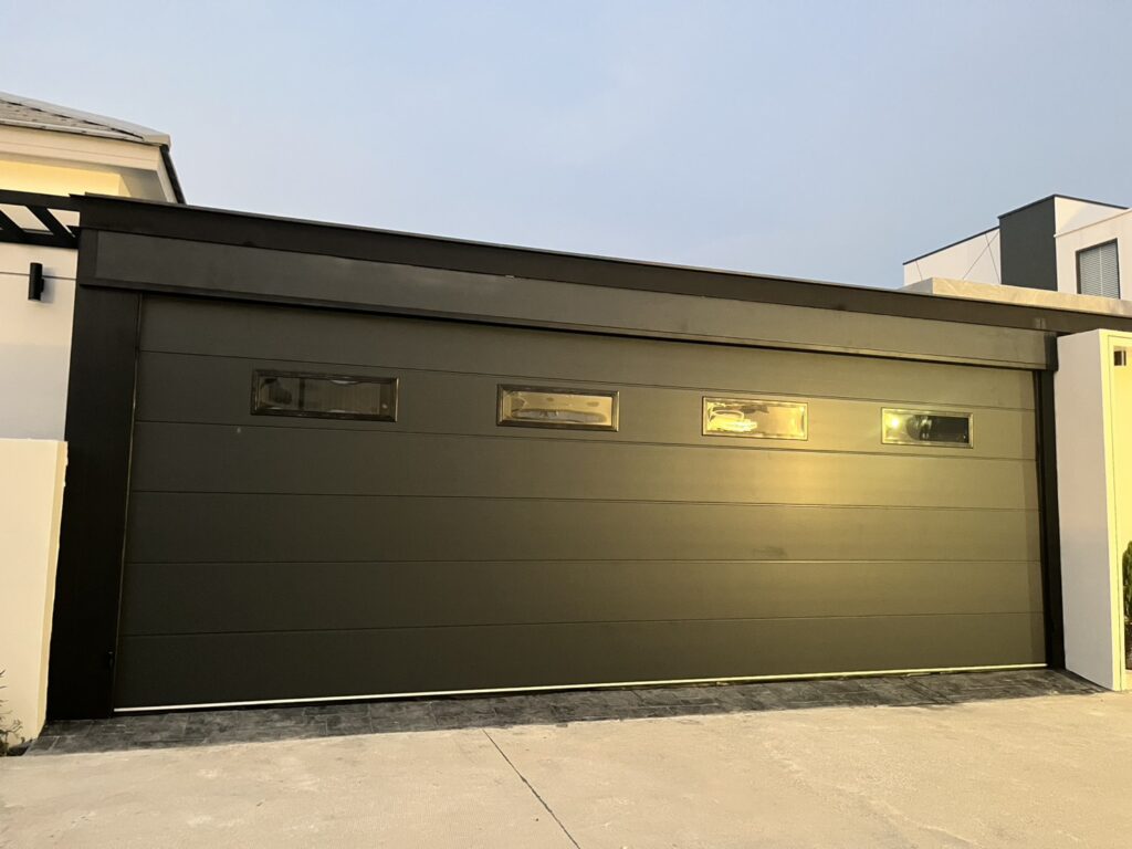 Installation photo of Standard Garage Door for Single House in Chonburi by OZ DOOR