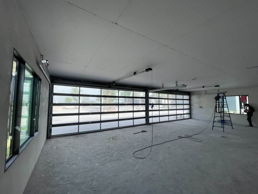 Installation photo of Full View Garage Door for Single House in Saraburi by OZ DOOR (2)