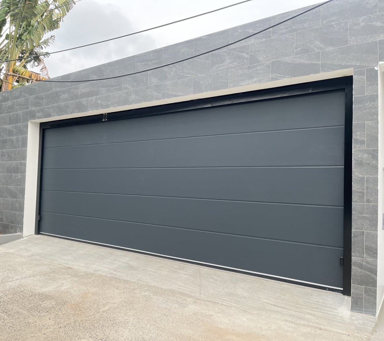Installation photo of Standard Garage Door for Single House in Phuket by OZ DOOR