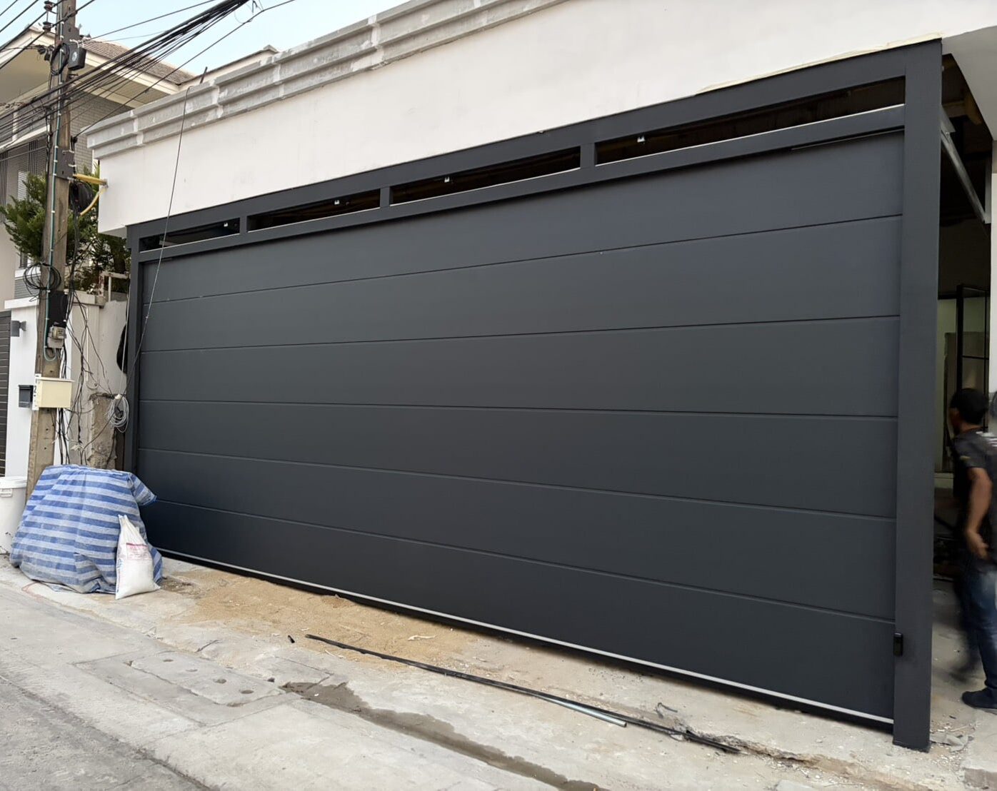 Installation photo of Garage Doors for Single House in Bangkok by OZ DOOR