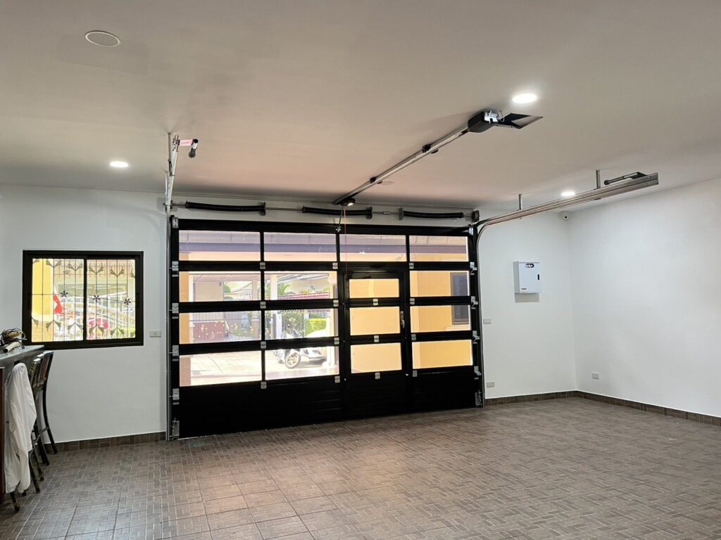 Installation photo of Full View Garage Door for Single House in Chonburi by OZ DOOR