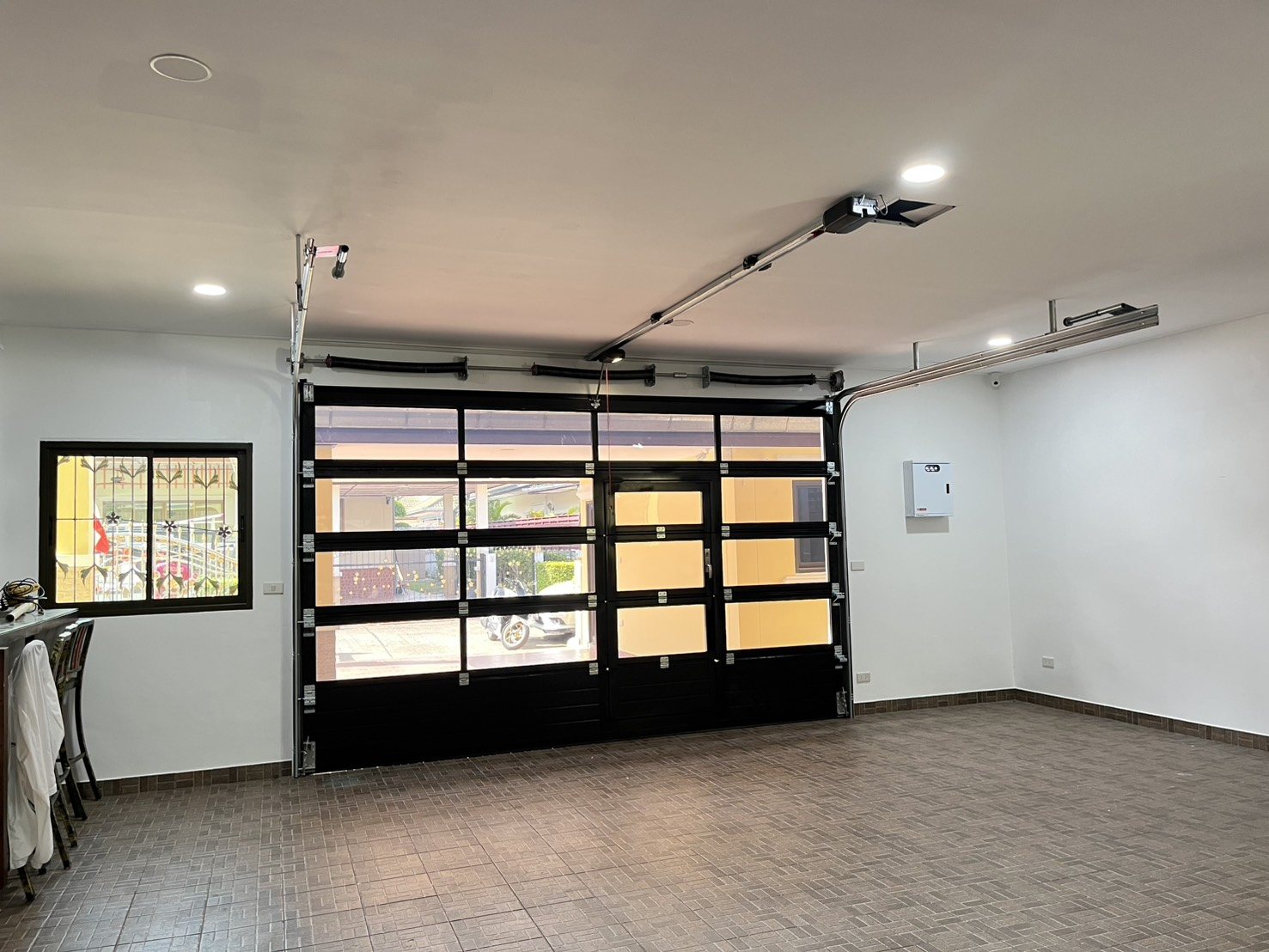 Installation photo of Full View Garage Door for Single House in Chonburi by OZ DOOR
