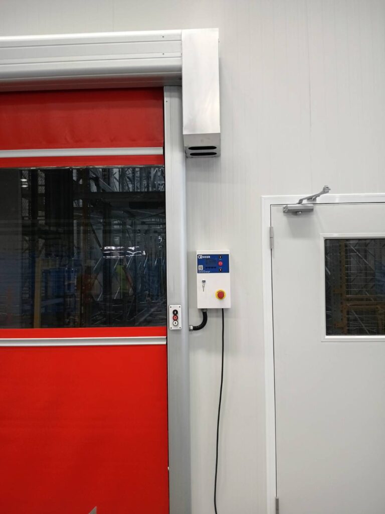 Edge of the red curtain and side-mounted control unit